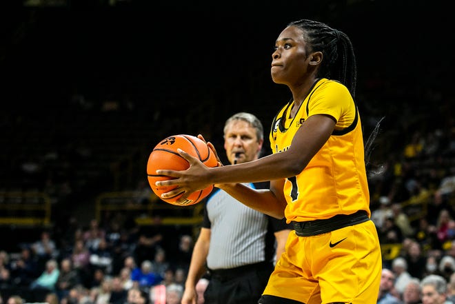 Iowa guard Tomi Taiwo (1) shoots a 3-point basket during a NCAA non-conference women's basketball game against New Hampshire, Tuesday, Nov. 9, 2021, at Carver-Hawkeye Arena in Iowa City, Iowa.