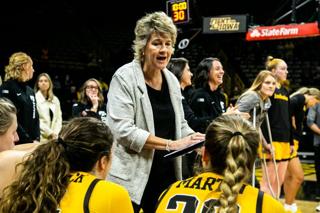 Iowa head coach Lisa Bluder talks with players before a NCAA non-conference women's basketball game against New Hampshire, Tuesday, Nov. 9, 2021, at Carver-Hawkeye Arena in Iowa City, Iowa.