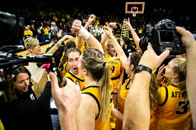 Iowa Hawkeyes guard Kate Martin and teammates huddle up after a NCAA non-conference women's basketball game against New Hampshire, Tuesday, Nov. 9, 2021, at Carver-Hawkeye Arena in Iowa City, Iowa.