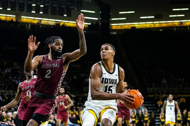 Iowa forward Keegan Murray (15) drives to the basket against North Carolina Central's Kris Monroe during a NCAA non-conference men's basketball game, Tuesday, Nov. 16, 2021, at Carver-Hawkeye Arena in Iowa City, Iowa.