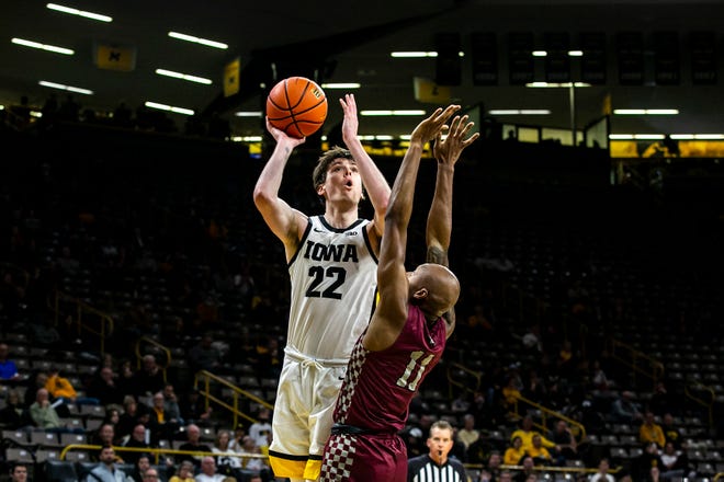 Iowa forward Patrick McCaffery (22) drives to the basket against North Carolina Central's Marque Maultsby during a NCAA non-conference men's basketball game, Tuesday, Nov. 16, 2021, at Carver-Hawkeye Arena in Iowa City, Iowa.