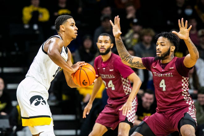 Iowa forward Keegan Murray, left, looks to pass as North Carolina Central's Dontavius King during a NCAA non-conference men's basketball game, Tuesday, Nov. 16, 2021, at Carver-Hawkeye Arena in Iowa City, Iowa.