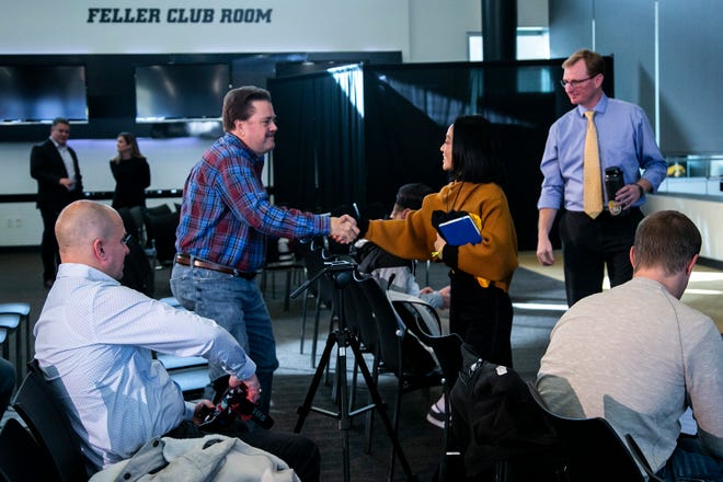 Clarissa Chun greets reproters after a news conference announcing her as the head coach for the women's wrestling program, Friday, Nov. 19, 2021, at Carver-Hawkeye Arena in Iowa City, Iowa.