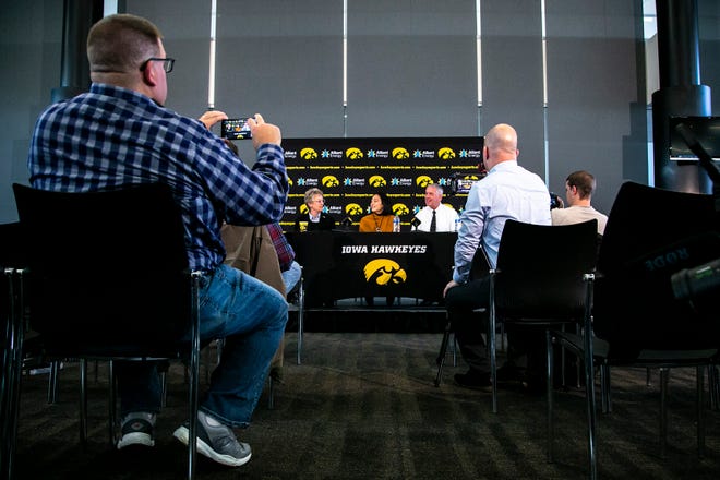 Barbara Burke, University of Iowa's deputy director of athletics, left, Clarissa Chun, center, and Iowa athletic director Gary Barta speak during a news conference announcing Chun as the inaugural head coach for the women's wrestling program, Friday, Nov. 19, 2021, at Carver-Hawkeye Arena in Iowa City, Iowa.