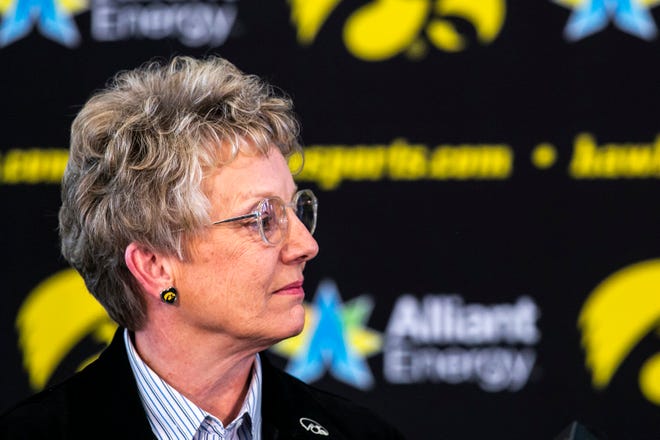 Barbara Burke, University of Iowa deputy director of athletics, listens during a news conference announcing Clarissa Chun as the head coach for the women's wrestling program, Friday, Nov. 19, 2021, at Carver-Hawkeye Arena in Iowa City, Iowa.