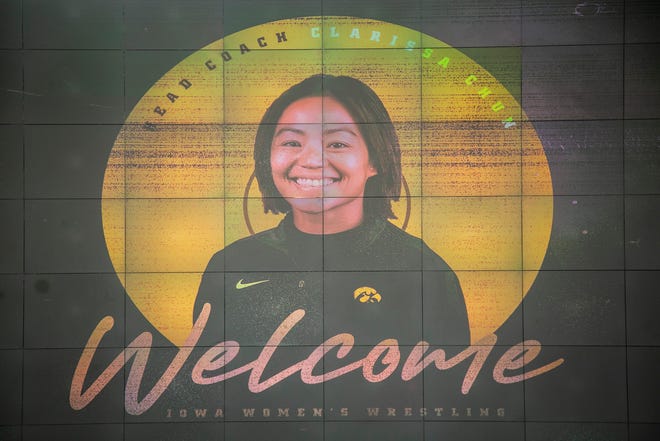 A graphic welcoming Clarissa Chun is seen during a news conference announcing Chun as the inaugural head coach for the women's wrestling program, Friday, Nov. 19, 2021, at Carver-Hawkeye Arena in Iowa City, Iowa.