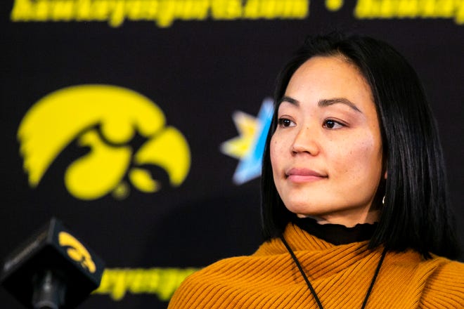 Clarissa Chun listens during a news conference announcing her as the head coach for the women's wrestling program, Friday, Nov. 19, 2021, at Carver-Hawkeye Arena in Iowa City, Iowa.