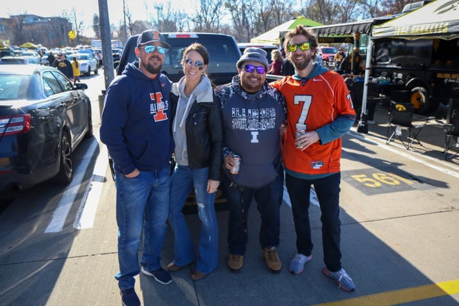 Left to right: Ben and Kelli Wiggins, Rob Cervantes and Nick Sharp, of  Moline, Illinois, tailgate outside Kinnick Stadium before the Iowa football game against Illinois in Iowa City on Sat., Nov. 20, 2021.