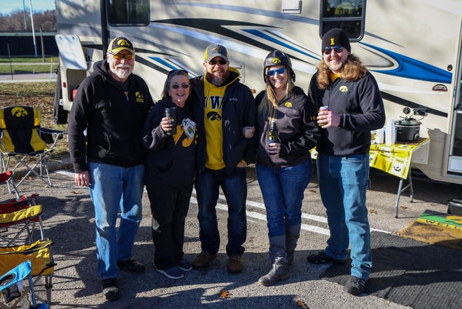 Left to right: Don and Linda Kraklio, Forrest and Linda Griggs and Andy Sessle, of Wilton, tailgate before the Iowa football game against Illinois in Iowa City on Sat., Nov. 20, 2021.