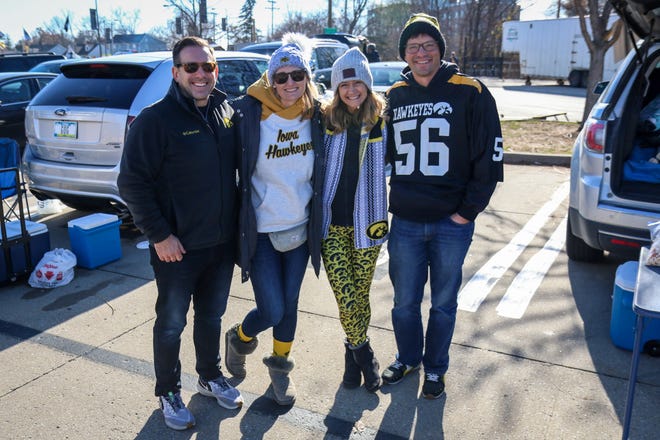 Left to right: Korey and Angela Birkenholtz and Jolene and Tim Vos tailgate outside Kinnick Stadium before the Iowa football game against Illinois in Iowa City on Sat., Nov. 20, 2021.