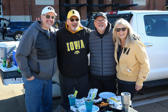 Left to right: Wan Cross, Renee Toledo, and Bob and Janel Lesan, of North Liberty, tailgate before the Iowa football game against Illinois in Iowa City on Sat., Nov. 20, 2021.