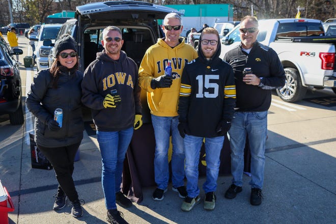 Left to right: Nicole Watson, Scott Dobesh, Brad and Trent Hesse and Daniel Zimmerman, of Des Moines, tailgate before the Iowa football game against Illinois in Iowa City on Sat., Nov. 20, 2021.