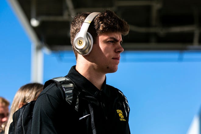 Iowa defensive back Cooper DeJean walks into the stadium before a NCAA college football game in the Vrbo Citrus Bowl against Kentucky, Saturday, Jan. 1, 2022, at Camping World Stadium in Orlando, Fla.