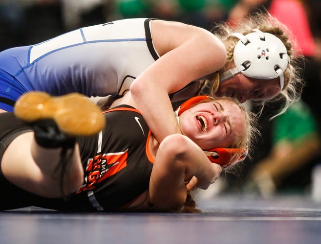 Underwood's Molly Allen wrestles Ames' Greta Goodman at 105 pounds during the first session of the Iowa Wrestling Coaches and Officials Association (IWCOA) girls' state wrestling tournament, Friday, Jan. 21, 2022, at the Xtream Arena in Coralville, Iowa.