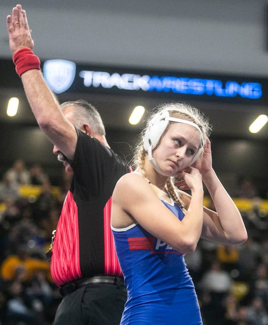 Perry’s Taylor Atwell reacts after falling during her match during the first session of the Iowa Wrestling Coaches and Officials Association (IWCOA) girls' state wrestling tournament, Friday, Jan. 21, 2022, at the Xtream Arena in Coralville, Iowa.