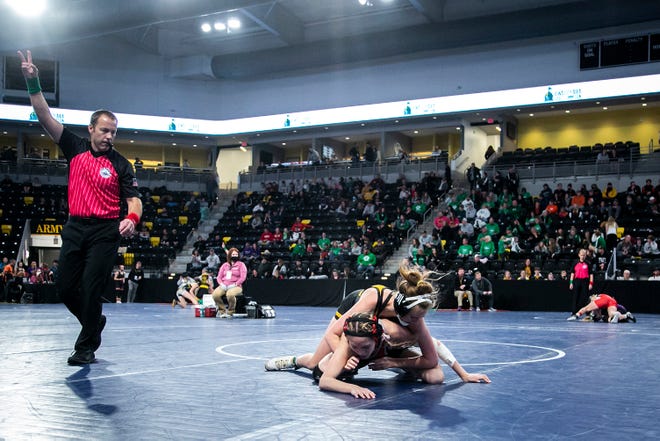 Bettendorf's Anna Davison, top, wrestles Kamina Munson at 115 pounds during the first session of the Iowa Wrestling Coaches and Officials Association (IWCOA) girls' state wrestling tournament, Friday, Jan. 21, 2022, at the Xtream Arena in Coralville, Iowa.