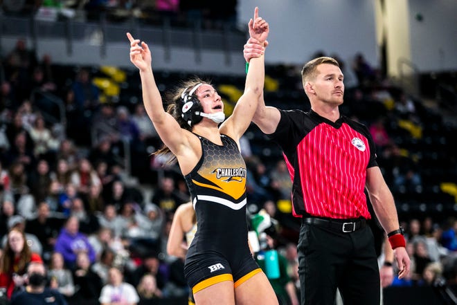 Charles City's Lilly Luft celebrates after scoring a decision at 130 pounds in the finals during of the Iowa Wrestling Coaches and Officials Association (IWCOA) girls' state wrestling tournament, Saturday, Jan. 22, 2022, at the Xtream Arena in Coralville, Iowa.