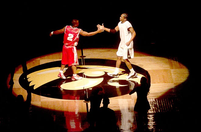 Iowa guard Pierre Pierce, right, shakes hands with Wisconsin guard Travon Davis during the introductions in a Big Ten opener with Wisconsin, Jan. 2, 2002 at Carver Hawkeye Arena. Iowa defeated Wisconsin 69-57.