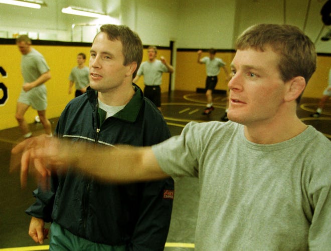 Iowa wrestling coach Jim Zalesky, left and assistant Tom Brands direct at 1997 practice.