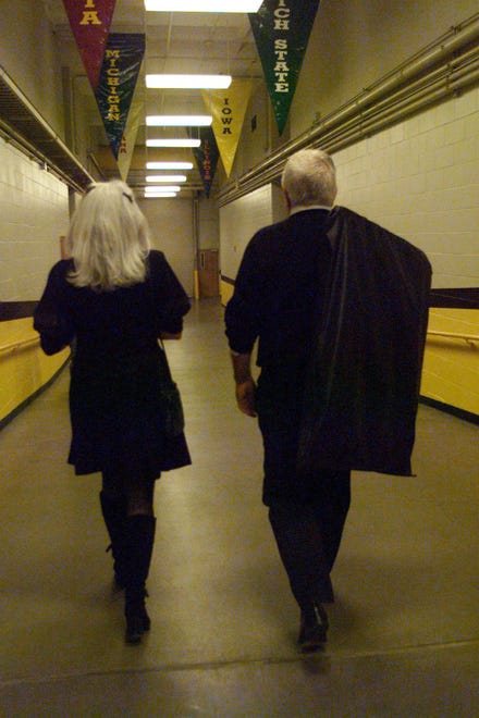 1999: Iowa Coach Tom Davis, right, and his wife Shari make their familiar walk through Carver-Hawkeye Arena.