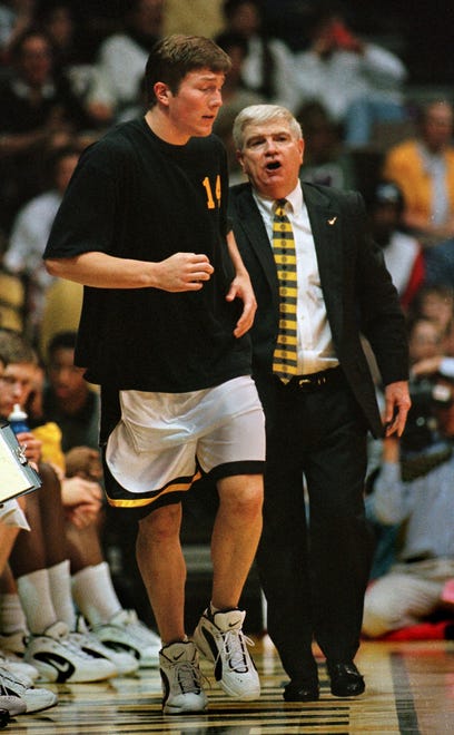 1996: Iowa coach Tom Davis, right, sends Chris Kingsbury into game vs. Michigan State shortly before the end of the first half in Iowa City.