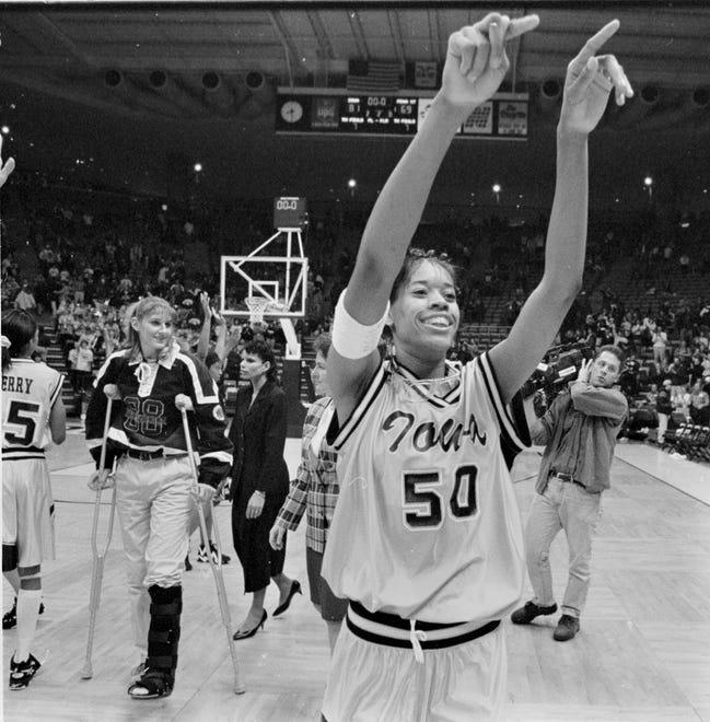 1996: Iowa's Tangela Smith acknowledges the crowd after 81-69 victory over Penn State at Carver-Hawkeye Arena.