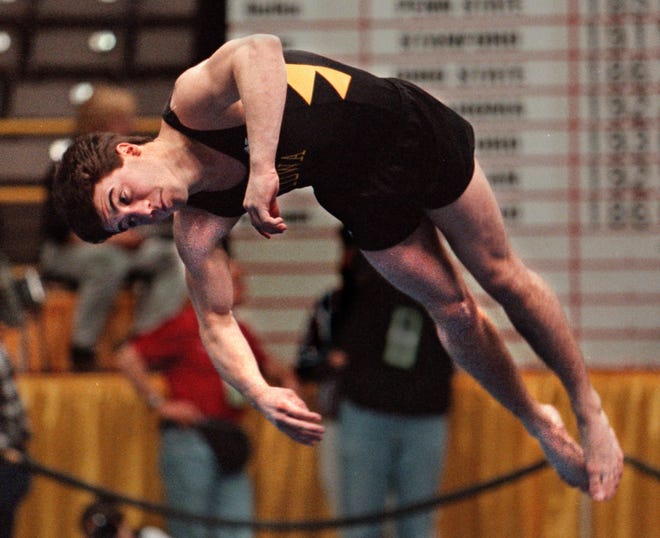 Chris Camiscioli of Iowa does his floor exercise routine on in the NCAA men's gymnastics meet, April 4, 1997, at Carver-Hawkeye Arena.