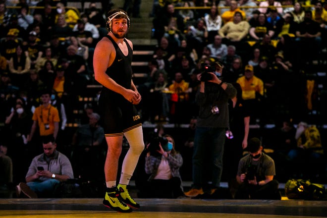 Iowa's Jacob Warner is introduced before wrestling at 197 pounds during a NCAA Big Ten Conference wrestling dual against Penn State, Friday, Jan. 28, 2022, at Carver-Hawkeye Arena in Iowa City, Iowa.