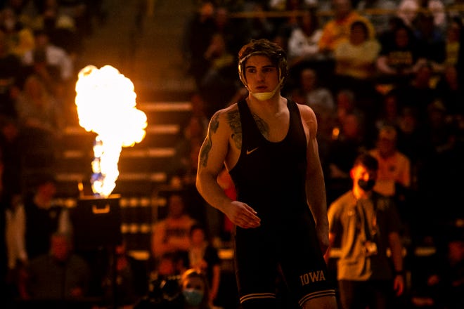 Iowa's Abe Assad is introduced before wrestling at 184 pounds during a NCAA Big Ten Conference wrestling dual against Penn State, Friday, Jan. 28, 2022, at Carver-Hawkeye Arena in Iowa City, Iowa.