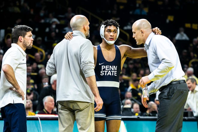 Penn State's Carter Starocci talks with coaches while wrestling at 174 pounds during a NCAA Big Ten Conference wrestling dual against Iowa, Friday, Jan. 28, 2022, at Carver-Hawkeye Arena in Iowa City, Iowa.