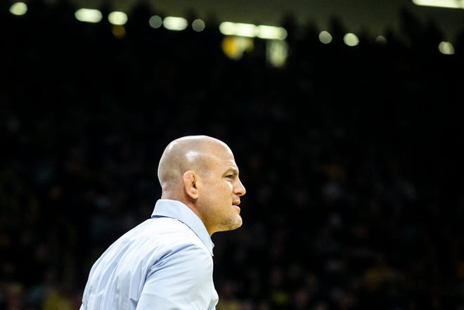 Penn State head coach Cael Sanderson watches during a NCAA Big Ten Conference wrestling dual against Iowa, Friday, Jan. 28, 2022, at Carver-Hawkeye Arena in Iowa City, Iowa.