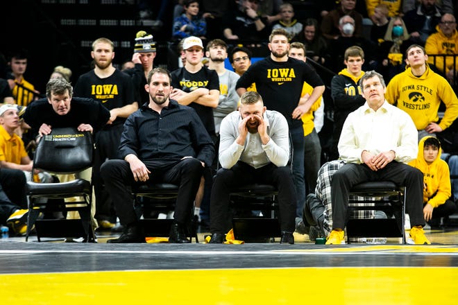 From left, Iowa associate head coach Terry Brands, volunteer assistant coach Bobby Telford, assistant coach Ryan Morningstar and head coach Tom Brands watch during a NCAA Big Ten Conference wrestling dual against Penn State, Friday, Jan. 28, 2022, at Carver-Hawkeye Arena in Iowa City, Iowa.
