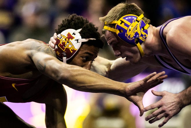 Iowa State's David Carr, left, wrestles Northern Iowa's Derek Holschlag at 157 pounds during a NCAA college Big 12 wrestling dual, Friday, Feb. 11, 2022, at the McLeod Center in Cedar Falls, Iowa.