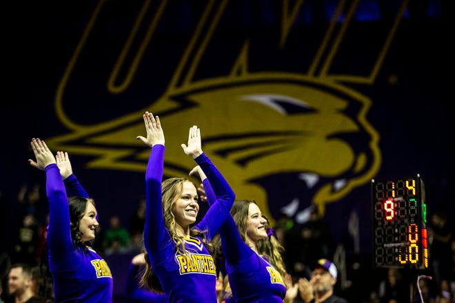 Northern Iowa cheerleaders applaud during a NCAA college Big 12 wrestling dual against Iowa State, Friday, Feb. 11, 2022, at the McLeod Center in Cedar Falls, Iowa.