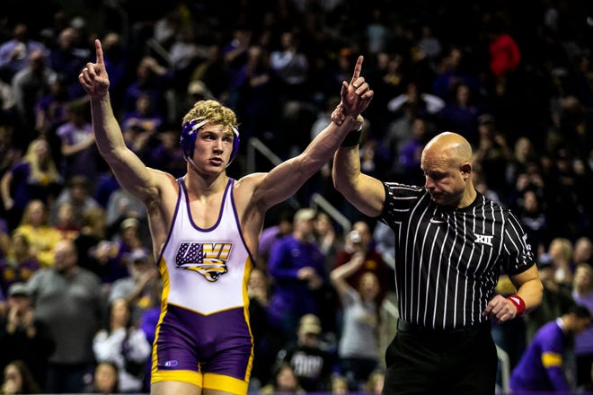 Northern Iowa's Lance Runyon, left, reacts after scoring a decision at 174 pounds during a NCAA college Big 12 wrestling dual against Iowa State, Friday, Feb. 11, 2022, at the McLeod Center in Cedar Falls, Iowa.