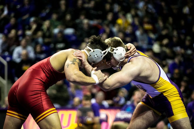 Iowa State's Yonger Bastida, left, wrestles Northern Iowa's John Gunderson at 197 pounds during a NCAA college Big 12 wrestling dual, Friday, Feb. 11, 2022, at the McLeod Center in Cedar Falls, Iowa.