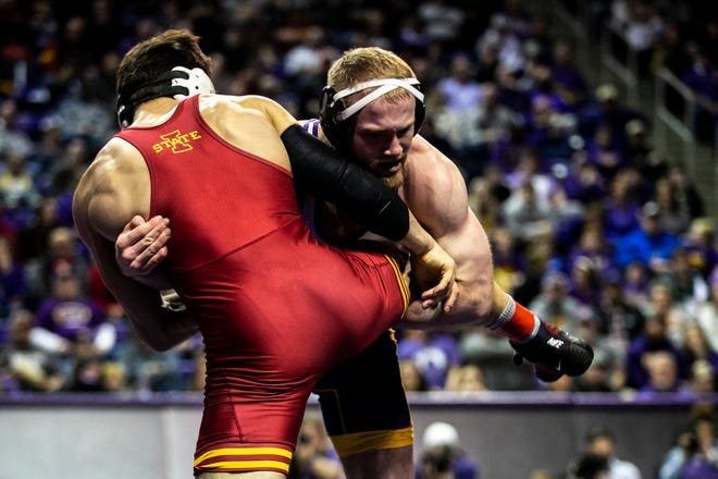 Northern Iowa's Cael Happel, right, wrestles Iowa State's Ian Parker at 141 pounds during a NCAA college Big 12 wrestling dual, Friday, Feb. 11, 2022, at the McLeod Center in Cedar Falls, Iowa.
