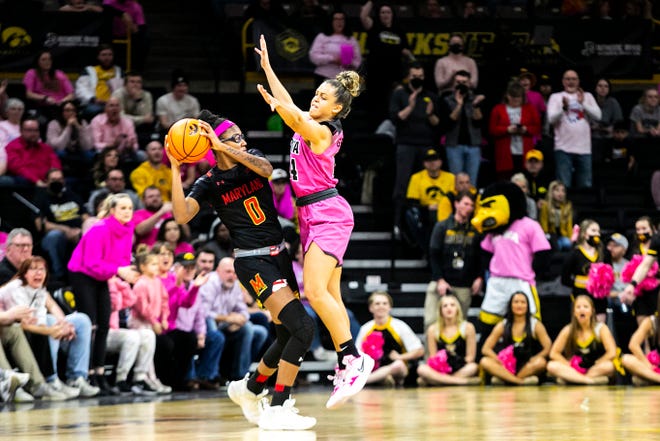 Iowa guard Gabbie Marshall, right, defends Maryland guard Shyanne Sellers (0) during a NCAA Big Ten Conference women's basketball game, Monday, Feb. 14, 2022, at Carver-Hawkeye Arena in Iowa City, Iowa.