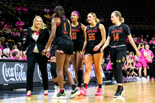From left, Maryland head coach Brenda Frese talks with players Diamond Miller, Angel Reese, Chloe Bibby and Taisiya Kozlova during a NCAA Big Ten Conference women's basketball game against Iowa, Monday, Feb. 14, 2022, at Carver-Hawkeye Arena in Iowa City, Iowa.