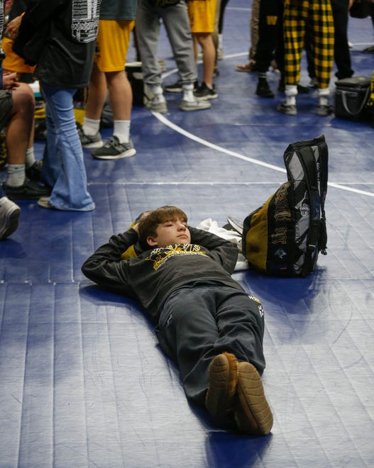 A Winterset wrestler relaxes after the consolation dual match against Burlington Notre Dame during the Iowa high school state wrestling dual meet at Wells Fargo Arena in Des Moines on Wednesday, Feb. 16, 2022.