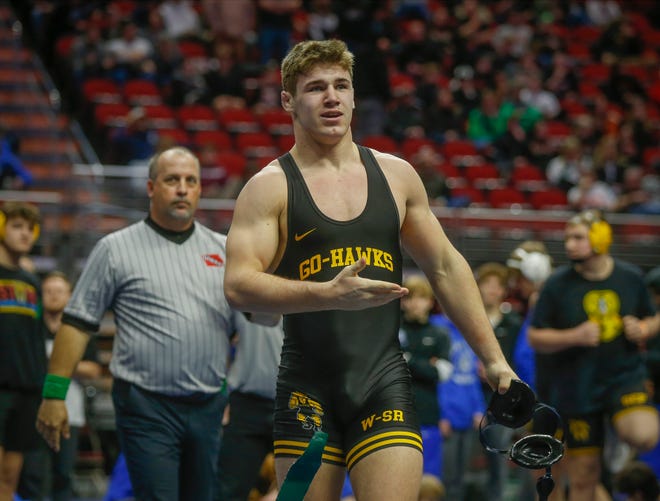 Waverly-Shell Rock's McCrae Hagarty celebrates after pinning Southeast Polk's Thaden Abbas in their match at 195 pounds during the Iowa high school state wrestling dual meet at Wells Fargo Arena in Des Moines on Wednesday, Feb. 16, 2022.