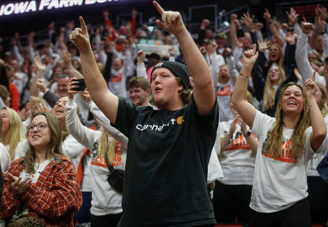 West Delaware fans cheer on Cody Monaghan as he wrestles Independence's Brady McDonald in their match at 285 pounds during the Iowa high school state wrestling dual meet at Wells Fargo Arena in Des Moines on Wednesday, Feb. 16, 2022.