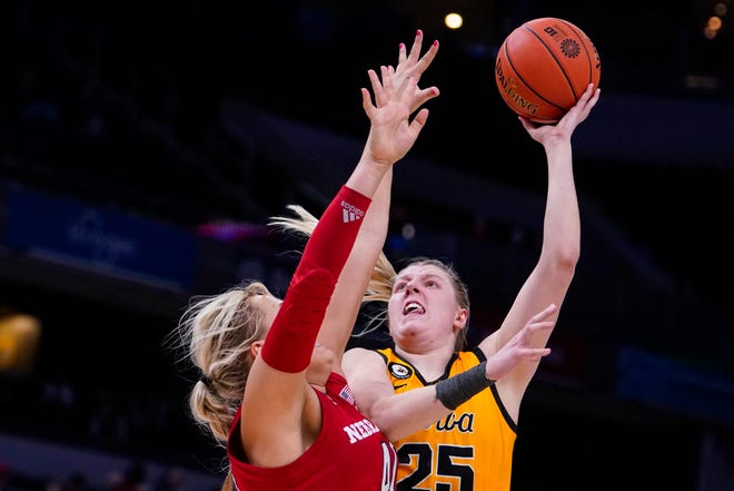 Iowa forward Monika Czinano (25) shoots over Nebraska center Alexis Markowski (40) in the second half of an NCAA college basketball game at the Big Ten Conference tournament, Saturday, March 5, 2022, in Indianapolis.