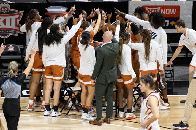 Mar 12, 2022; Kansas City, MO, USA; Texas Longhorns players and coaches huddle in the second half against the Iowa State Cyclones at Municipal Auditorium. Mandatory Credit: Amy Kontras-USA TODAY Sports