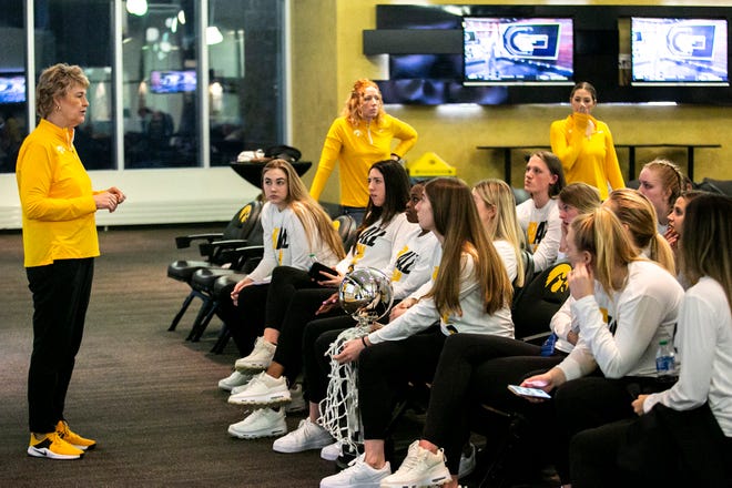Iowa head coach Lisa Bluder talks with players at a NCAA Tournament Selection Sunday watch party, Sunday, March 13, 2022, at Carver-Hawkeye Arena in Iowa City, Iowa.