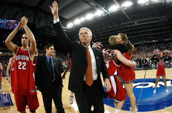 Davidson coach Bob McKillop and his team celebrate their 73-56 win against Wisconsin in the 2008 Sweet 16 in Detroit.