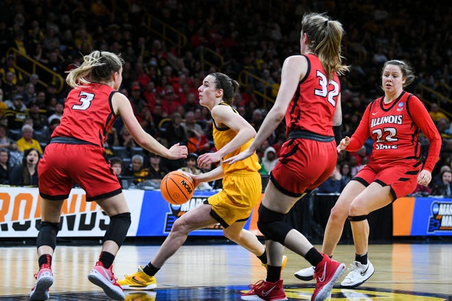 Iowa's guard Caitlin Clark (22) drives to the basket against Illinois State during the opening round of the Women's NCAA Basketball Tournament at Carver-Hawkeye Arena Friday, March 18, 2022, in Iowa City.