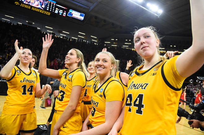 Iowa players celebrate after beating Illinois State during the opening round of the Women's NCAA Basketball Tournament at Carver-Hawkeye Arena Friday, March 18, 2022, in Iowa City.