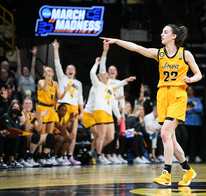 Iowa's guard Caitlin Clark (22) and bench celebrates a 3-pointer against Illinois State during the opening round of the Women's NCAA Basketball Tournament at Carver-Hawkeye Arena Friday, March 18, 2022, in Iowa City.