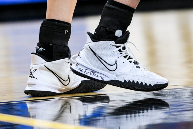 Iowa's forward Monika Czinano (25) has the phrase "Peace for Ukraine" on her shoes during the opening round of the Women's NCAA Basketball Tournament against Illinois State at Carver-Hawkeye Arena Friday, March 18, 2022, in Iowa City.